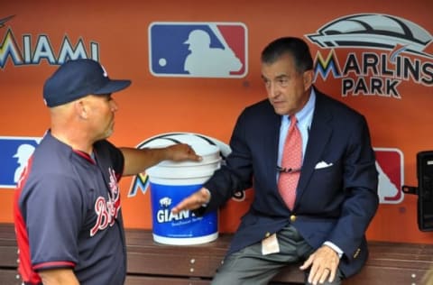 Apr 6, 2015; Miami, FL, USA; Atlanta Braves manager Fredi Gonzalez (left) talks with Braves president John Schuerholz (right) prior to a game against the Miami Marlins at Marlins Park. Mandatory Credit: Steve Mitchell-USA TODAY Sports