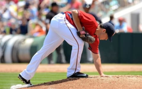 Mar 31, 2015; Fort Myers, FL, USA; Minnesota Twins starting pitcher Tommy Milone (33) brushes off the rubber on the pitcher