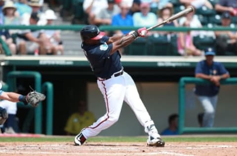 Apr 1, 2016; Lake Buena Vista, FL, USA; Atlanta Braves third baseman Adonis Garcia (13) singles during the fourth inning against the Tampa Bay Rays at Champion Stadium. Mandatory Credit: Kim Klement-USA TODAY Sports