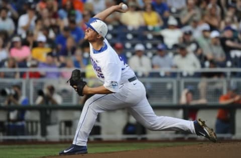 Jun 13, 2015; Omaha, NE, USA; Florida Gators outfielder Buddy Reed (23) drives in a run in the fourth inning against the Miami Hurricanes in the 2015 College World Series at TD Ameritrade Park. Mandatory Credit: Steven Branscombe-USA TODAY Sports