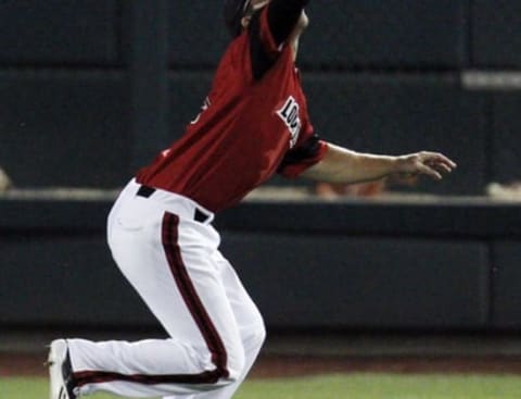 Jun 14, 2014; Omaha, NE, USA; Louisville Cardinals right fielder Corey Ray (2) catches the fly ball against the Vanderbilt Commodores during game two of the 2014 College World Series at TD Ameritrade Park Omaha. Vanderbilt won 5-3. Mandatory Credit: Bruce Thorson-USA TODAY Sports