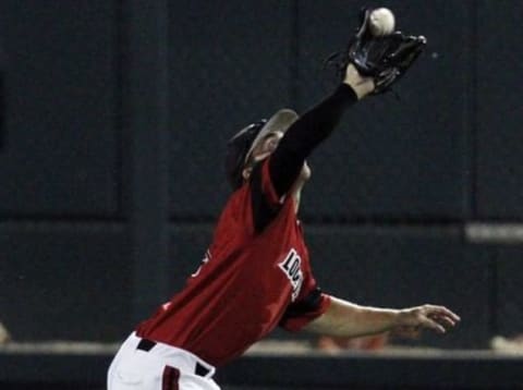 Jun 14, 2014; Omaha, NE, USA; Louisville Cardinals right fielder Corey Ray (2) catches the fly ball against the Vanderbilt Commodores during game two of the 2014 College World Series at TD Ameritrade Park Omaha. Vanderbilt won 5-3. Mandatory Credit: Bruce Thorson-USA TODAY Sports