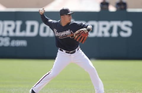 Mar 8, 2016; Lake Buena Vista, FL, USA; Atlanta Braves shortstop Daniel Castro (14) throws to first during the second inning of a spring training baseball game against the New York Mets at Champion Stadium. Mandatory Credit: Reinhold Matay-USA TODAY Sports