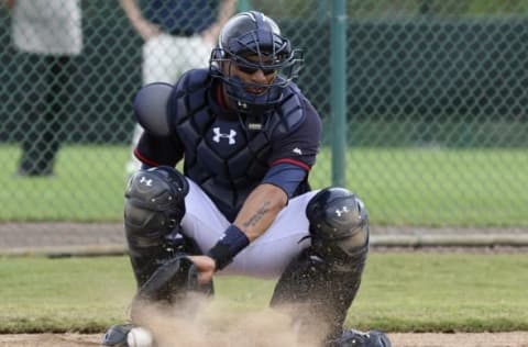 Feb 23, 2015; Lake Buena Vista, FL, USA; Atlanta Braves catcher Christian C. Betancourt digs a ball out of the dirt during spring training workouts at Champion Stadium. Mandatory Credit: Reinhold Matay-USA TODAY Sports