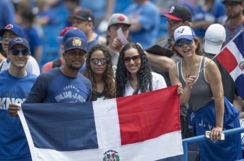 May 29, 2016; Toronto, Ontario, CAN; Fans from the Dominican Republic show their support for the Toronto Blue Jays during batting practice before a game against the Boston Red Sox at Rogers Centre. Mandatory Credit: Nick Turchiaro-USA TODAY Sports