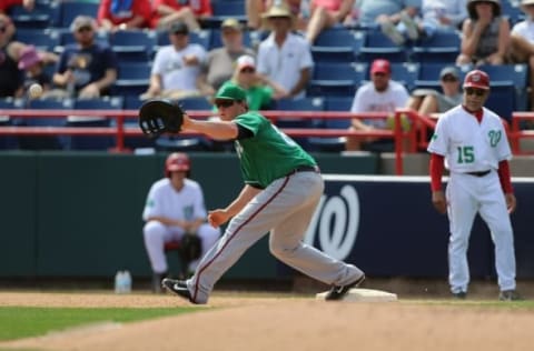 Mar 17, 2016; Melbourne, FL, USA; Atlanta Braves first baseman Jake Schrader (89) fields a ball in the seventh inning against the Washington Nationals at Space Coast Stadium. The Washington Nationals won 9-7. Mandatory Credit: Logan Bowles-USA TODAY Sports