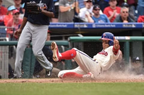 May 22, 2016; Philadelphia Phillies second baseman Cesar Hernandez (16) scores on a single hit by third baseman Maikel Franco (not pictured) in the sixth inning against the Atlanta Braves at Citizens Bank Park. The Phillies won 5-0. Mandatory Credit: John Geliebter-USA TODAY Sports