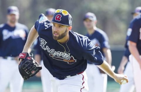 Feb 22, 2016; Lake Buena Vista, FL, USA; Atlanta Braves pitcher Chris Elllis fields the ball during spring training workouts at ESPN