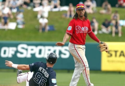 Mar 11, 2016; Lake Buena Vista, FL, USA; Atlanta Braves Dustin Peeterson (96) slides safely into second base as Philadelphia Phillies shortstop Emmanuel Burriss (15) indicates no throw during the second inning at Champion Stadium. Mandatory Credit: Butch Dill-USA TODAY Sports