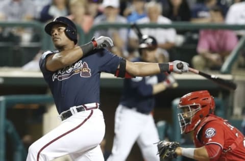 Mar 12, 2016; Lake Buena Vista, FL, USA; Atlanta Braves third baseman Hecctor Olivera (28) bats during the sixth inning of a spring training baseball game against the Washington Nationals at Champion Stadium. Mandatory Credit: Reinhold Matay-USA TODAY Sports