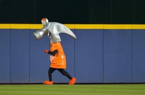 Jul 22, 2014; Atlanta, GA, USA; A Home Depot mascot, the hammer, runs along the outfield wall during the sixth inning of the game between the Atlanta Braves and the Miami Marlins at Turner Field. Mandatory Credit: Kevin Liles-USA TODAY Sports