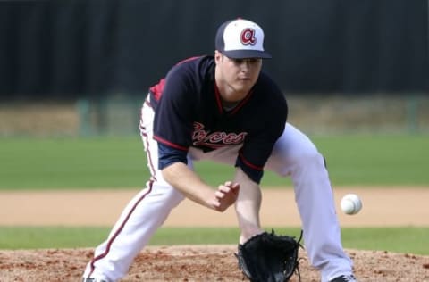 Feb 23, 2015; Lake Buena Vista, FL, USA; Atlanta Braves pitcher Jason Hursh fields a ground ball during spring training workouts at Champion Stadium. Mandatory Credit: Reinhold Matay-USA TODAY Sports