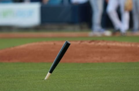 Mar 16, 2016; Tampa, FL, USA; A piece of Toronto Blue Jays third baseman Josh Donaldson (not pictured) bat lays in the grass after being broken during an at bat against the New York Yankees in the third inning at George M. Steinbrenner Field. Mandatory Credit: Kim Klement-USA TODAY Sports