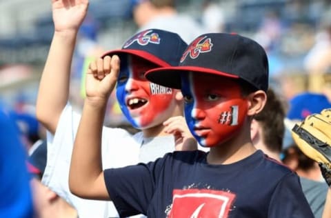 Jun 12, 2016; Atlanta, GA, USA; Atlanta Braves tomahawk squad on top of the dugout during the game against the Chicago Cubs during the seventh inning at Turner Field. Mandatory Credit: Dale Zanine-USA TODAY Sports