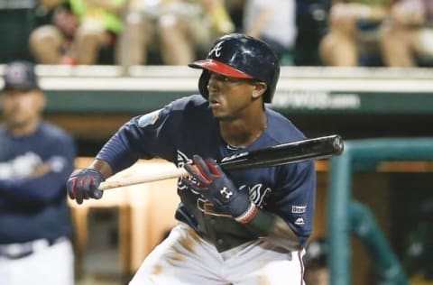 Mar 12, 2016; Lake Buena Vista, FL, USA; Atlanta Braves shortstop Ozzie Albiies (87) tries to bunt during the third inning of a spring training baseball game against the Washington Nationals at Champion Stadium. Mandatory Credit: Reinhold Matay-USA TODAY Sports