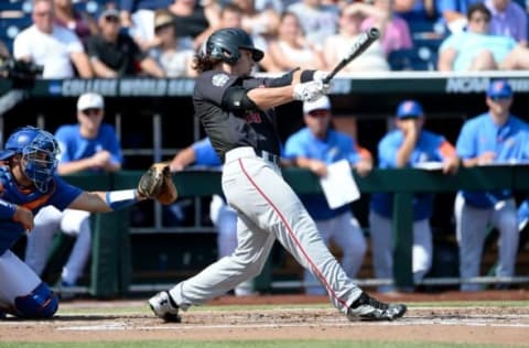 Jun 21, 2016; Omaha, NE, USA; Texas Tech Red Raiders outfielder Tyler Nesslony (10) singles in the second inning against the Florida Gators in the 2016 College World Series at TD Ameritrade Park. Mandatory Credit: Steven Branscombe-USA TODAY Sports