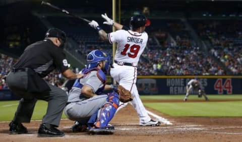 Jun 24, 2016; Atlanta, GA, USA; Atlanta Braves third baseman Brandon Snnyder (19) hits a three-run home run as New York Mets catcher Travis d