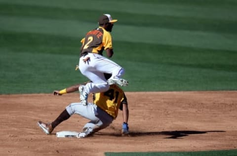 Jul 10, 2016; San Diego, CA, USA; World runner Jorge Bonifacio (bottom) is forced out by USA infielder Travis Demeritte during the All Star Game futures baseball game at PetCo Park. Mandatory Credit: Jake Roth-USA TODAY Sports