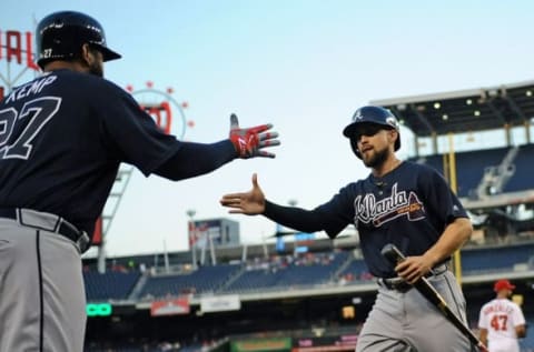 Sep 6, 2016; Washington, DC, USA; Atlanta Braves center fielder Ender Inciarte (11) is congratulated by left fielder Matt Kemp (27) after scoring a run during the first inning against the Washington Nationals at Nationals Park. Mandatory Credit: Brad Mills-USA TODAY Sports