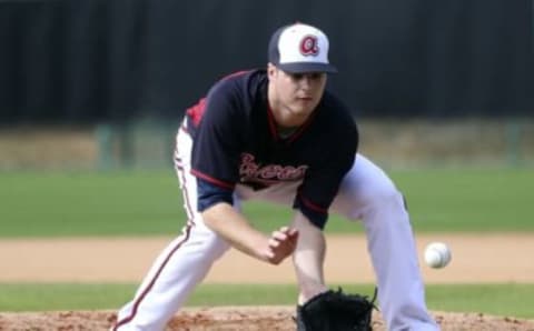 Feb 23, 2015; Lake Buena Vista, FL, USA; Atlanta Braves pitcher Jason Hursh fields a ground ball during spring training workouts at Champion Stadium. Mandatory Credit: Reinhold Matay-USA TODAY Sports