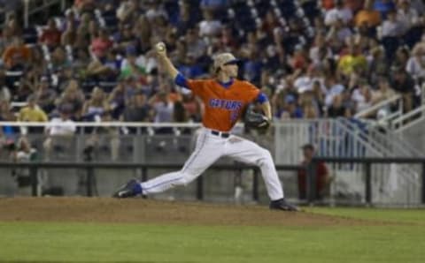 Jun 20, 2015; Omaha, NE, USA; Florida Gators pitcher Taylor Lewis (16) throws against the Virginia Cavaliers in the sixth inning at the 2015 College World Series at TD Ameritrade Park. Virginia won 5-4. Mandatory Credit: Bruce Thorson-USA TODAY Sports