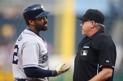 Jul 6, 2015; Pittsburgh, PA, USA; San Diego Padres right fielder Matt Kemp (27) talks with home plate umpire Paul Emmel (50) after Kemp struck out against the Pittsburgh Pirates during the first inning at PNC Park. Mandatory Credit: Charles LeClaire-USA TODAY Sports