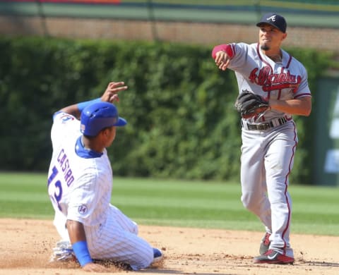 Aug 23, 2015; Chicago, IL, USA; Atlanta Braves second baseman Jace Peterson (8) forces out Chicago Cubs second baseman Starlin Castro (13) and throws to first base during the seventh inning at Wrigley Field. Mandatory Credit: Dennis Wierzbicki-USA TODAY Sports