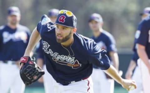 Feb 22, 2016; Lake Buena Vista, FL, USA; Atlanta Braves pitcher Chris Ellis fields the ball during spring training workouts at ESPN