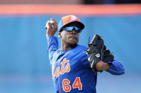 Feb 22, 2016; Port St. Lucie, FL, USA; New York Mets relief pitcher Akeel Morris (64) throws in the outfield during spring training work out drills at Tradition Field. Mandatory Credit: Steve Mitchell-USA TODAY Sports