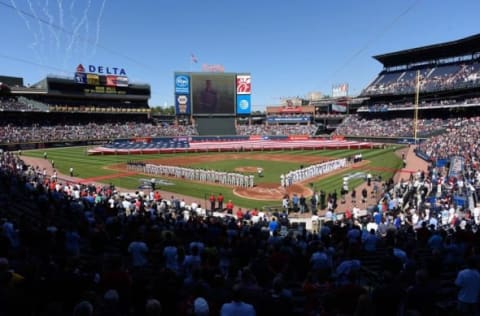 Apr 4, 2016; Atlanta, GA, USA; The teams lineup and the flag is pulled across the outfield prior to the game between the Washington Nationals and the Atlanta Braves at Turner Field. Mandatory Credit: Dale Zanine-USA TODAY Sports