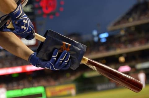 May 23, 2016; Washington, DC, USA; New York Mets second baseman Neil Walker (20) prepares his bat while in the on deck circle in the first inning against the Washington Nationals at Nationals Park. Mandatory Credit: Tommy Gilligan-USA TODAY Sports