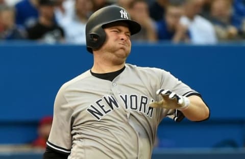 Jun 1, 2016; Toronto, Ontario, CAN; New York Yankees catcher Brian McCann (34) reacts after fouling a ball off his right foot in the second inning at Rogers Centre. Mandatory Credit: Dan Hamilton-USA TODAY Sports