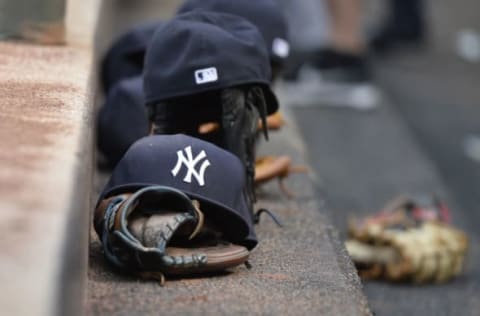 Jun 4, 2016; Baltimore, MD, USA; A general view of the hat and glove of New York Yankees second baseman Starlin Castro (14) during the first inning against the Baltimore Orioles at Oriole Park at Camden Yards. Mandatory Credit: Tommy Gilligan-USA TODAY Sports