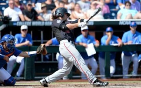 Jun 21, 2016; Omaha, NE, USA; Texas Tech Red Raiders outfielder Tyler Neslony (10) singles in the second inning against the Florida Gators in the 2016 College World Series at TD Ameritrade Park. Mandatory Credit: Steven Branscombe-USA TODAY Sports