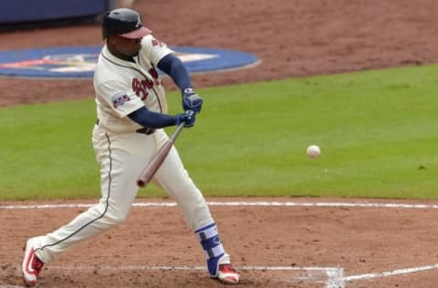 Sep 18, 2016; Atlanta, GA, USA; Atlanta Braves third baseman Adonis Garcia (13) singles driving in a run against the Washington Nationals during the fourth inning at Turner Field. Mandatory Credit: Dale Zanine-USA TODAY Sports