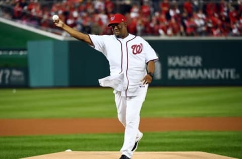 Oct 13, 2016; Washington, DC, USA; Former Washington Nationals pitcher Livan Hernandez throws out the first pitch prior to game five of the 2016 NLDS playoff baseball game against the Los Angeles Dodgers at Nationals Park. Mandatory Credit: Brad Mills-USA TODAY Sports