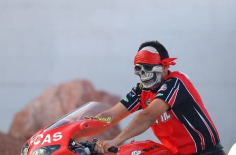 Oct 29, 2016; Las Vegas, NV, USA; NHRA pro stock motorcycle rider Hector Arana Jr wears a halloween mask during qualifying for the Toyota Nationals at The Strip at Las Vegas Motor Speedway. Mandatory Credit: Mark J. Rebilas-USA TODAY Sports