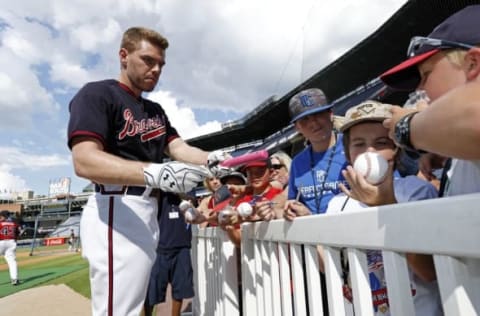 Jul 15, 2016; Atlanta, GA, USA; Atlanta Braves first baseman Freddie Freeman (5) signs autographs for fans before their game against the Colorado Rockies at Turner Field. Mandatory Credit: Jason Getz-USA TODAY Sports