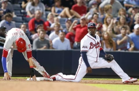 Jul 29, 2016; Atlanta, GA, USA; Atlanta Braves third baseman Adonis Garcia (13) forces out Philadelphia Phillies left fielder Tyler Goeddel (2) in the ninth inning at Turner Field. The Braves defeated the Phillies 2-1. Mandatory Credit: Brett Davis-USA TODAY Sports