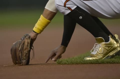 Sep 2, 2016; Baltimore, MD, USA; Baltimore Orioles third baseman Manny Machado (13) writes on the infield dirt before the game against the New York Yankees at Oriole Park at Camden Yards. Mandatory Credit: Tommy Gilligan-USA TODAY Sports