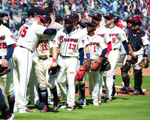 ATLANTA, GA – JULY 29: Sean Newcomb #15 of the Atlanta Braves is congratulated by Ender Inciarte #11 as teammates line up to greet Newcomb after throwing a one-hit game through 8 2/3 innings against the Los Angeles Dodgers at SunTrust Park on July 29, 2018 in Atlanta, Georgia. (Photo by Scott Cunningham/Getty Images)