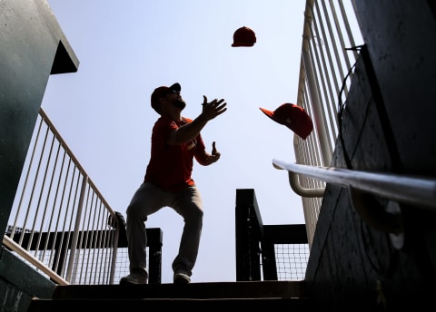 KANSAS CITY, MO – AUGUST 12: Bud Norris #26 of the St. Louis Cardinals attempts to catch hats throws at him by fans before the game against the Kansas City Royals at Kauffman Stadium on August 12, 2018 in Kansas City, Missouri. (Photo by Brian Davidson/Getty Images)