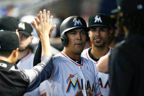 MIAMI, FL – AUGUST 12: Rafael Ortega #52 of the Miami Marlins celebrates with teammates after scoring in the first inning against the New York Mets at Marlins Park on August 12, 2018 in Miami, Florida. (Photo by Michael Reaves/Getty Images)