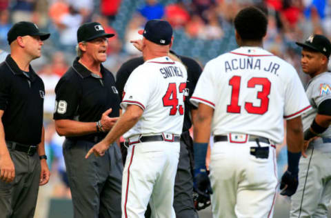 ATLANTA, GA – AUGUST 15: Manager Brian Snitker #43 of the Atlanta Braves argues with the umpires after Ronald Acuna Jr. #13was hit by a pitch during the first inning against the Miami Marlins at SunTrust Park on August 15, 2018 in Atlanta, Georgia. (Photo by Daniel Shirey/Getty Images)