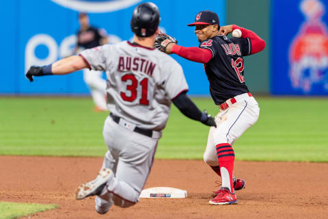 CLEVELAND, OH – AUGUST 29: Shortstop Francisco Lindor #12 of the Cleveland Indians loses his grip on the throw to first as Tyler Austin #31 of the Minnesota Twins is out at second during the fourth inning at Progressive Field on August 29, 2018 in Cleveland, Ohio. (Photo by Jason Miller/Getty Images)