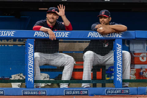 CLEVELAND, OH – SEPTEMBER 1: Josh Donnaldson #27 of the Cleveland Indians joins Carlos Carrrasco #59 on the bench and waves to the Tampa Bay Rays bench during the fifth inning at Progressive Field on September 1, 2018 in Cleveland, Ohio. Donaldson is the Indians latest trade coming from the Toronto Blue Jays. (Photo by Jason Milller/Getty Images)