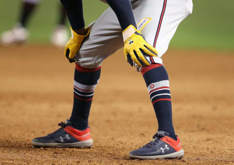 PHOENIX, AZ – SEPTEMBER 09: Under Armour gloves and shoes of Ozzzie Albies #1 of the Atlanta Braves during the fifth inning of an MLB game against the Arizona Diamondbacks at Chase Field on September 9, 2018 in Phoenix, Arizona. (Photo by Ralph Frreso/Getty Images)