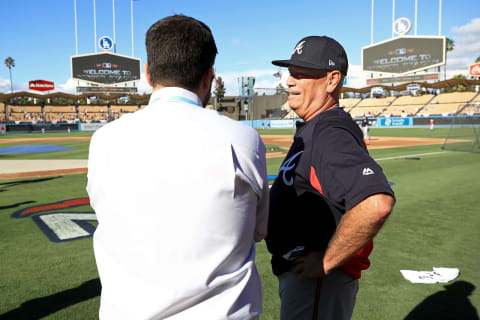 LOS ANGELES, CA – OCTOBER 04: General manager Alex Anthopoulos and manager Brian Snitker #43 of the Atlanta Braves talk during batting practice prior to Game One of the National League Division Series against the Los Angeles Dodgers at Dodger Stadium on October 4, 2018 in Los Angeles, California. (Photo by Sean M. Haffey/Getty Images)