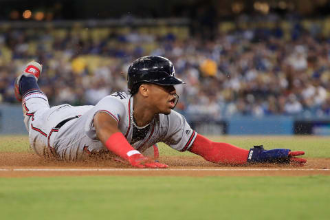 LOS ANGELES, CA – OCTOBER 05: Ronald Acuna Jr. #13 of the Atlanta Braves slides into third base during the first inning against the Los Angeles Dodgers during Game Two of the National League Division Series at Dodger Stadium on October 5, 2018 in Los Angeles, California. (Photo by Sean M. Haffey/Getty Images)