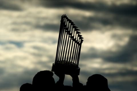 BOSTON, MA – OCTOBER 31: The World Series trophy is hoisted in the air during the 2018 World Series victory parade for the Boston Red Sox on October 31, 2018 in Boston, Massachusetts. (Photo by Adam Glanzman/Getty Images)